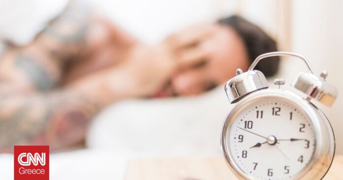 e79c9cb1-man-sleeping-with-alarm-clock-wooden-desk-og.jpg